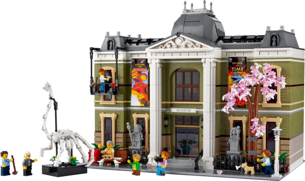 The LEGO Natural History Museum, a two-storey modular museum building with a dinosaur skeleton on a stand beside it and minifigures in front